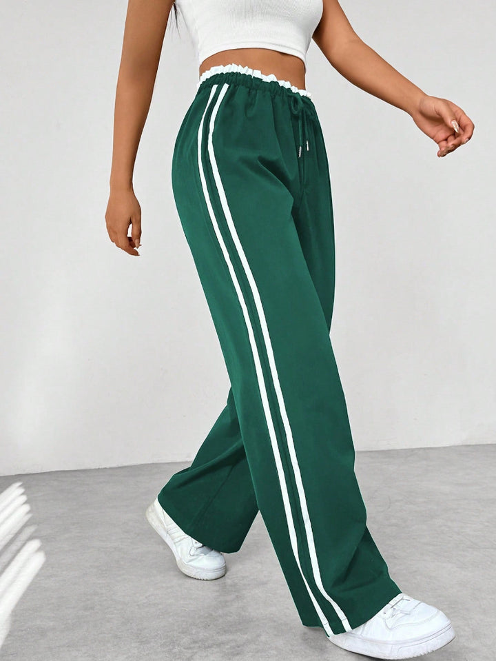 Pantalón Deportivo para Mujer de Pernera Ancha con Rayas Laterales