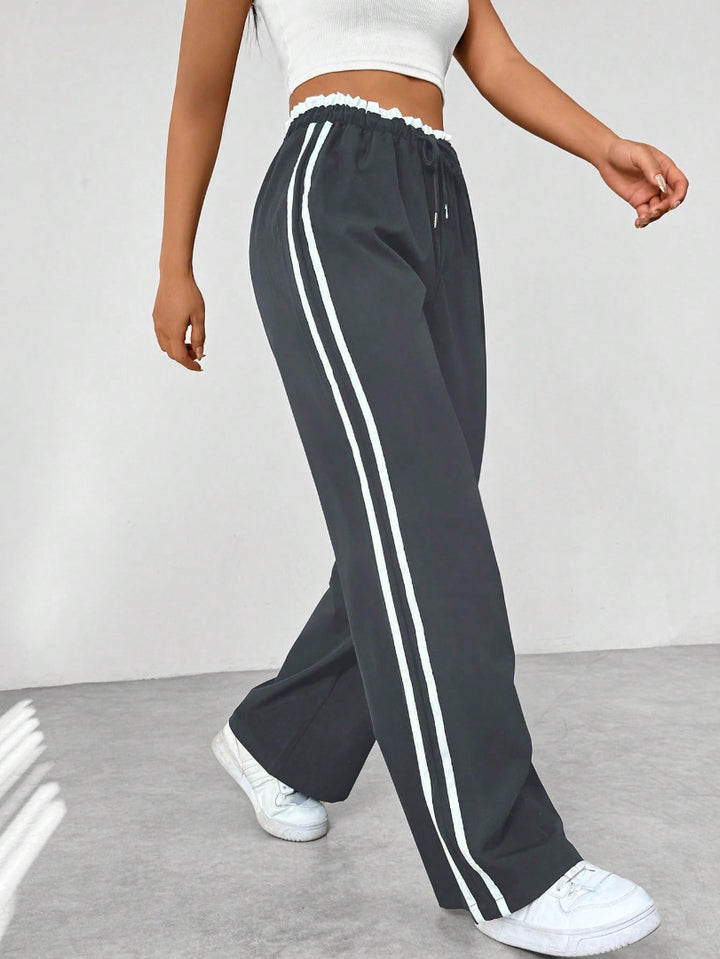 Pantalón Deportivo para Mujer de Pernera Ancha con Rayas Laterales